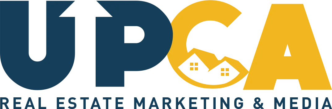 UPCA Real Estate Marketing and Media logo with navy and gold lettering featuring a house and mountain graphic